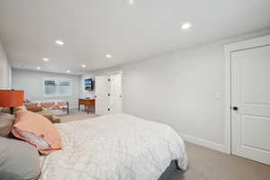 Bedroom with light colored carpet