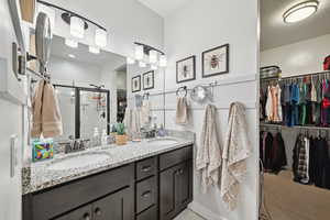 Bathroom with vanity and walk in shower