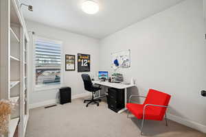 Home office featuring carpet