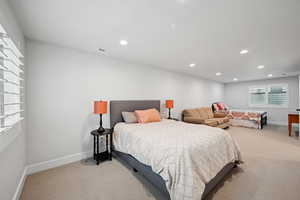 Bedroom with light colored carpet