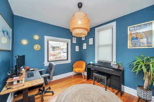 Office with wood-type flooring