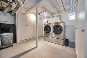 Laundry room featuring washing machine and clothes dryer