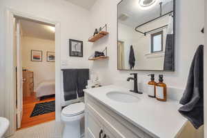 Bathroom with vanity and toilet