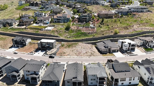 Birds eye view of property with a residential view