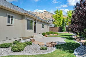 View of yard featuring a mountain view and a patio