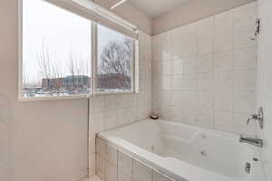 Bathroom with a relaxing tiled tub