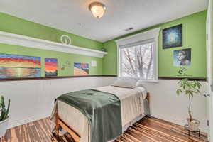 Bedroom with a textured ceiling