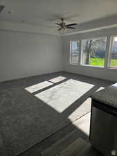 Empty room featuring ceiling fan