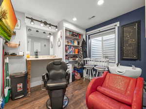 Living area featuring dark hardwood / wood-style flooring