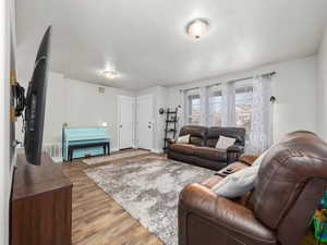 Living room with light wood-type flooring