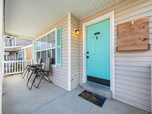 Property entrance with covered porch