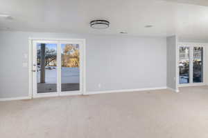 Family room with carpet and french doors