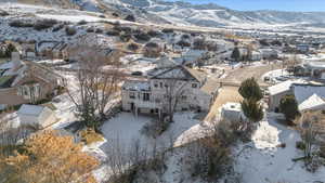 Snowy aerial view with a mountain view