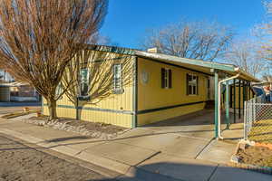 View of home's exterior featuring a carport