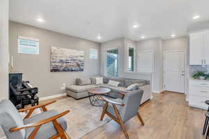 Living room with light hardwood / wood-style floors