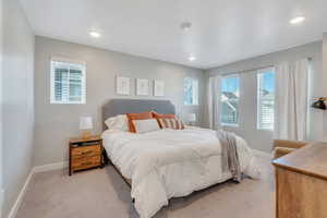 Bedroom with light carpet