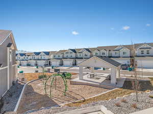 Exterior space featuring a garage and a gazebo