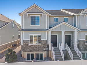 Craftsman-style home with cooling unit