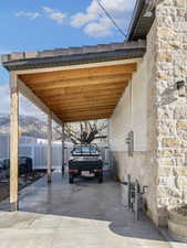 View of parking featuring a carport