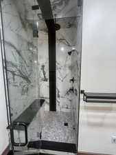 Bathroom with a shower with door