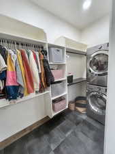 Washroom featuring stacked washer / dryer