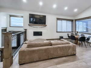 Living room with lofted ceiling