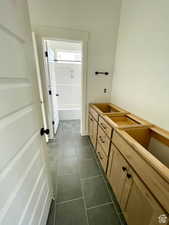 Bathroom with tile patterned flooring and vanity