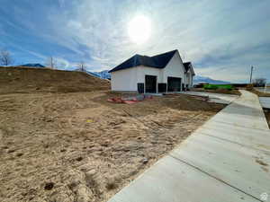 View of home's exterior with a mountain view