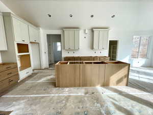 Kitchen with a center island and a wealth of natural light