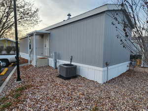 View of side of property with central AC