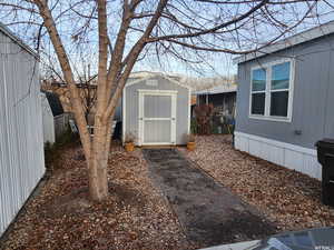 View of yard featuring a storage shed