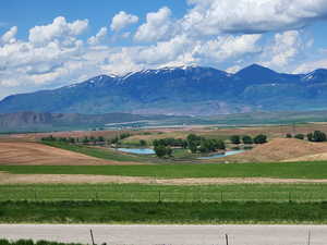 View of mountain feature featuring a rural view and a water view