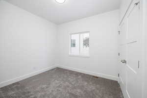 Empty room featuring carpet floors