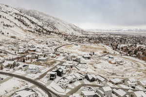 Snowy aerial view featuring a mountain view