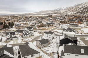 Snowy aerial view featuring a mountain view