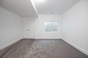 Empty room featuring carpet floors