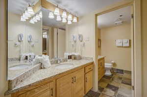 Full bathroom with double vanity.