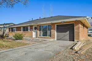 Ranch-style house featuring a garage