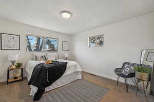 Bedroom featuring carpet flooring