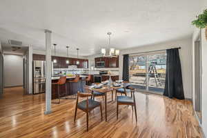 Dining area featuring light hardwood / wood-style flooring