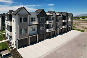 View of front of house with a mountain view and central AC