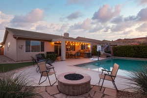 View of pool with a patio area, an outdoor fire pit, a fenced in pool, and a water slide