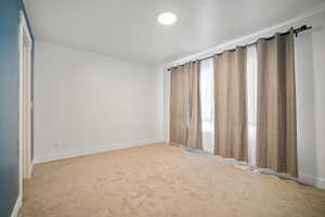 Spare room with light carpet