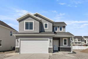 View of front of home featuring a garage