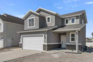 View of front of home featuring a garage