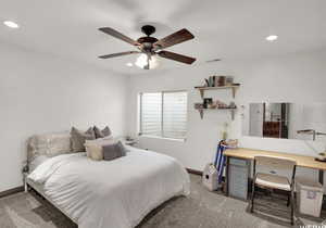 Bedroom with carpet and ceiling fan