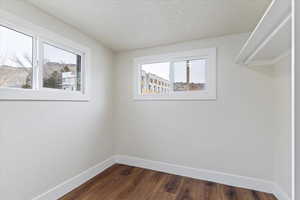 Interior space featuring dark wood-type flooring