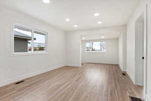 Unfurnished room with light hardwood / wood-style flooring