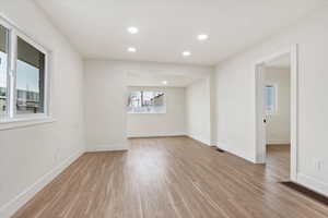 Unfurnished room with light wood-type flooring