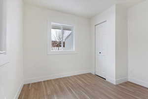 Spare room with light hardwood / wood-style flooring